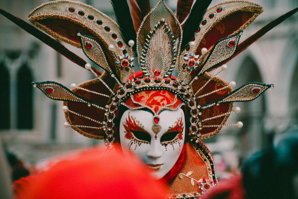Detailed close-up of an ornate Venetian carnival mask with intricate designs at the Venice Carnival.